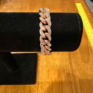Rose Gold and White Crystal Women's Bracelet with Double Latch Closure.